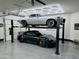 Garage featuring a car lift, showcasing elevated parking and maximizing garage space at 2748 E Warbler Rd, Gilbert, AZ 85297