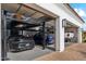 Car lift providing additional parking and modern garage with a rear exit at 2748 E Warbler Rd, Gilbert, AZ 85297
