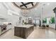 Bright open-concept kitchen featuring a large island, modern appliances, and a unique chandelier, perfect for entertaining at 2748 E Warbler Rd, Gilbert, AZ 85297