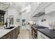Modern kitchen featuring white cabinets, stainless steel appliances, and a large kitchen island at 2748 E Warbler Rd, Gilbert, AZ 85297
