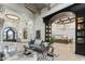 Expansive living room with high ceilings, wood beams, and open layout into the kitchen at 2748 E Warbler Rd, Gilbert, AZ 85297