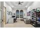 Spacious living room with a desk, comfortable seating, and decoratively adorned walls at 2748 E Warbler Rd, Gilbert, AZ 85297