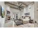 Spacious main bedroom with beamed ceilings, stone fireplace, and access to outdoor living area at 2748 E Warbler Rd, Gilbert, AZ 85297