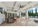 Expansive covered patio with a bar, ceiling fans, and stunning views of the pool and well-manicured backyard at 2748 E Warbler Rd, Gilbert, AZ 85297