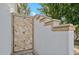 Stylish outdoor shower featuring stone tile work, adding a touch of luxury to the outdoor space at 2748 E Warbler Rd, Gilbert, AZ 85297