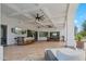 Outdoor patio with pool table, bar, and ceiling fans at 2748 E Warbler Rd, Gilbert, AZ 85297