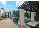 Resort-style pool with a pergola, tanning chairs, and lush landscaping for the ultimate relaxation experience at 2748 E Warbler Rd, Gilbert, AZ 85297