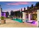 Inviting swimming pool with a pergola and waterfall features, creating a luxurious outdoor retreat at 2748 E Warbler Rd, Gilbert, AZ 85297