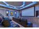 Luxury theater room with leather seating and custom lighting at 2748 E Warbler Rd, Gilbert, AZ 85297