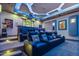 Home theater with tiered seating and custom ceiling lighting at 2748 E Warbler Rd, Gilbert, AZ 85297