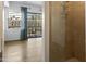 Shower with tile surround, opening to a bedroom with a view to the patio at 3131 N Central Ave # 3009, Phoenix, AZ 85012