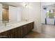 Modern bathroom featuring a double vanity, quartz countertop, and warm lighting at 3131 N Central Ave # 3009, Phoenix, AZ 85012