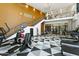 Large gym with multiple exercise machines and stylish design at 3131 N Central Ave # 3009, Phoenix, AZ 85012