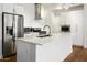 Modern kitchen featuring an island, stainless steel appliances, white cabinets, and an open design concept at 3131 N Central Ave # 3009, Phoenix, AZ 85012