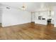Open-concept living and kitchen area featuring hardwood floors and modern lighting fixtures at 3131 N Central Ave # 3009, Phoenix, AZ 85012