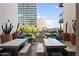 Inviting outdoor patio with lounge seating, dining tables, desert plants, and a cozy fire pit at 3131 N Central Ave # 3009, Phoenix, AZ 85012