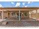 Wide covered patio with views of a private backyard featuring desert landscaping and a block fence at 325 N Redrock St, Gilbert, AZ 85234