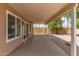 Covered patio area with view of the backyard featuring desert landscaping and block fencing at 325 N Redrock St, Gilbert, AZ 85234