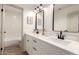 Modern bathroom featuring double sinks, quartz countertops, and black hardware at 325 N Redrock St, Gilbert, AZ 85234