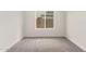 Small bedroom featuring a window and carpeted flooring at 325 N Redrock St, Gilbert, AZ 85234