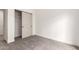 This cozy bedroom features a closet and is painted with white neutral colors at 325 N Redrock St, Gilbert, AZ 85234