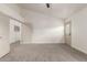 Large bedroom featuring vaulted ceilings, doorways to bathroom, closet, and outdoor access at 325 N Redrock St, Gilbert, AZ 85234
