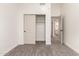 This cozy bedroom features a closet and is painted with white neutral colors at 325 N Redrock St, Gilbert, AZ 85234