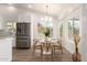 Charming dining area next to the kitchen, featuring a round table and plenty of natural light at 325 N Redrock St, Gilbert, AZ 85234