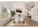 Dining area features modern chandelier, stylish decor, and large window for natural light at 325 N Redrock St, Gilbert, AZ 85234