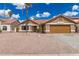 Charming single-story home showcasing a well-kept yard, desert landscaping, and a brown roof at 325 N Redrock St, Gilbert, AZ 85234