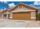 This single-story home features a two-car garage and low-maintenance desert landscaping at 325 N Redrock St, Gilbert, AZ 85234
