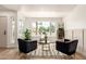 Bright living room featuring two armchairs, natural light and views of the neighborhood at 325 N Redrock St, Gilbert, AZ 85234