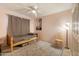 Bedroom with pink walls, ceiling fan and a twin bed with gray linens at 3410 W Pershing Ave, Phoenix, AZ 85029
