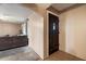 Entryway featuring a dark door, tile flooring and neutral colored walls at 3410 W Pershing Ave, Phoenix, AZ 85029