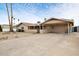 Charming house with desert landscaping and ample parking spaces with an attached carport at 3410 W Pershing Ave, Phoenix, AZ 85029