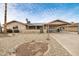 Single-story home featuring desert landscaping, a covered porch, and a convenient carport at 3410 W Pershing Ave, Phoenix, AZ 85029