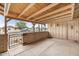 Inviting front porch with a brick surround, offering a relaxed outdoor living space at 3410 W Pershing Ave, Phoenix, AZ 85029