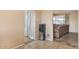 Hallway featuring tile flooring, an archway, a water cooler and a sofa in the distance at 3410 W Pershing Ave, Phoenix, AZ 85029