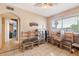 Room with a window featuring chairs, shelving and a view of the landscape at 3410 W Pershing Ave, Phoenix, AZ 85029