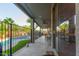 Covered back patio with ceiling fan, dining area, and pool view at 3523 W Buckhorn Trl, Phoenix, AZ 85083