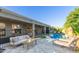Beautiful pool with patio furniture in a lush backyard at 3523 W Buckhorn Trl, Phoenix, AZ 85083