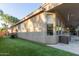 Back exterior with a covered patio, turf area, and patio furniture at 3523 W Buckhorn Trl, Phoenix, AZ 85083