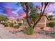 A charming single-story house features desert landscaping, complemented by a natural tree and visible neighboring home at 3523 W Buckhorn Trl, Phoenix, AZ 85083