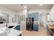 Bright kitchen with white countertops, blue cabinets, stainless steel appliances, and an open layout flowing into other living spaces at 3523 W Buckhorn Trl, Phoenix, AZ 85083