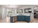Stylish kitchen island featuring a white countertop, blue cabinetry, stainless steel appliances, and pendant lighting at 3523 W Buckhorn Trl, Phoenix, AZ 85083