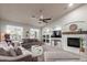 Cozy living room features a fireplace, built-in shelves, and a comfortable sofa, creating a relaxing atmosphere at 3523 W Buckhorn Trl, Phoenix, AZ 85083