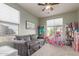 Inviting play room filled with natural light, a comfortable sofa, and plenty of space for toys and activities at 3523 W Buckhorn Trl, Phoenix, AZ 85083