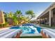Inviting backyard pool surrounded by lush landscaping and with lounge chairs for outdoor relaxation and enjoying outdoor living at 3523 W Buckhorn Trl, Phoenix, AZ 85083