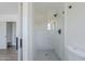 Stylish bathroom showcasing a glass-enclosed shower with trendy geometric tiling and modern fixtures at 3609 E Palm Ln, Phoenix, AZ 85008