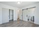This bedroom features a convenient closet and a modern barn door leading to the attached bathroom at 3609 E Palm Ln, Phoenix, AZ 85008